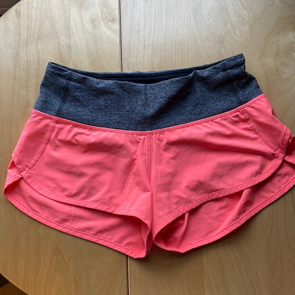Lululemon 4 speed short Coral color.  Regular 3 inch length.  EUC